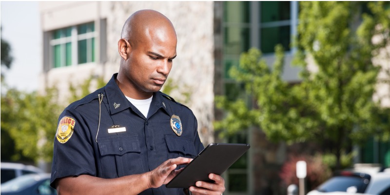 police officer using tablet for investigations